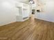 Open concept space with modern luxury vinyl plank flooring and a view of the kitchen at 13106 W Calavar Rd, Surprise, AZ 85379