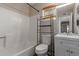 Bathroom featuring a shower-tub combo, toilet, modern vanity, and a window with blinds at 137 W Wagoner Rd, Phoenix, AZ 85023