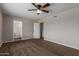 Bedroom with a ceiling fan and views of an attached bathroom at 137 W Wagoner Rd, Phoenix, AZ 85023