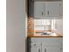Bright kitchen with white cabinets and wood countertops at 137 W Wagoner Rd, Phoenix, AZ 85023