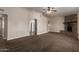 Cozy living room featuring a brick fireplace, neutral walls and ceiling fan at 137 W Wagoner Rd, Phoenix, AZ 85023