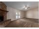 Inviting living room featuring a brick fireplace and outdoor access at 137 W Wagoner Rd, Phoenix, AZ 85023