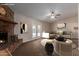 Staged living room featuring vaulted ceilings, a cozy fireplace, and comfortable seating at 137 W Wagoner Rd, Phoenix, AZ 85023
