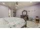 Bedroom featuring a ceiling fan, dresser, and light purple painted walls at 1441 E Folley Pl, Chandler, AZ 85225