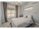 Charming bedroom featuring cloud painted walls, and a cozy bed near bright window at 1441 E Folley Pl, Chandler, AZ 85225