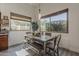 Dining room with natural light and gray wood table at 1441 E Folley Pl, Chandler, AZ 85225