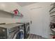 Well-equipped laundry room features modern LG washer and dryer set, enhancing convenience at 1441 E Folley Pl, Chandler, AZ 85225