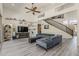 Large living room showcasing a winding staircase and high ceilings at 1441 E Folley Pl, Chandler, AZ 85225