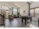 Spacious living room with a foosball table, vaulted ceilings, and large windows at 1441 E Folley Pl, Chandler, AZ 85225