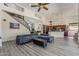 Open living room with a view of the kitchen, featuring a winding staircase at 1441 E Folley Pl, Chandler, AZ 85225