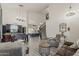 Expansive living room with a large TV, foosball table, and open staircase at 1441 E Folley Pl, Chandler, AZ 85225