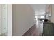 Long hallway with hardwood floors and a view of the living room at 1443 W Tigua Way, Coolidge, AZ 85128