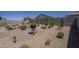 Picturesque backyard setting with desert landscaping, a cozy firepit and an outdoor grill at 1560 E Squire Dr, Casa Grande, AZ 85122