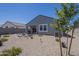 Enjoy a private backyard featuring a covered patio, desert landscaping and a well maintained fence at 1560 E Squire Dr, Casa Grande, AZ 85122