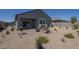 Attractive backyard featuring patio area and desert landscaping for low maintenance at 1560 E Squire Dr, Casa Grande, AZ 85122