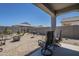 Charming backyard with a covered patio and well-maintained landscaping at 1560 E Squire Dr, Casa Grande, AZ 85122