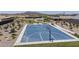 Aerial view of community basketball court with native desert landscaping and walking path at 1560 E Squire Dr, Casa Grande, AZ 85122