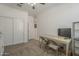 Bedroom with a desk, TV, ceiling fan and closet with sliding doors, suitable for work or study at 1560 E Squire Dr, Casa Grande, AZ 85122