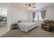 Bedroom with natural light, a ceiling fan, and cozy chair offers relaxation and peaceful sleep at 1560 E Squire Dr, Casa Grande, AZ 85122