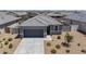 Inviting single-story home features a well-manicured yard and a two car garage at 1560 E Squire Dr, Casa Grande, AZ 85122