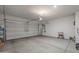 Spacious two car garage with a roll-up door and ample room for storage at 1560 E Squire Dr, Casa Grande, AZ 85122