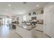 Open kitchen with a spacious island, stainless steel appliances, and views to the living room at 1560 E Squire Dr, Casa Grande, AZ 85122