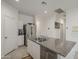 Spacious kitchen with a large island, stainless steel appliances, and access to storage and pantry at 1560 E Squire Dr, Casa Grande, AZ 85122