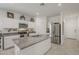 Kitchen featuring a large island with grey granite countertops, stainless steel appliances and white cabinetry at 1560 E Squire Dr, Casa Grande, AZ 85122