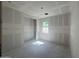 Spacious, unfinished bedroom, with a window that provides ample natural light at 16178 W Bajada Rd, Surprise, AZ 85387