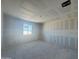 Unfinished bedroom featuring a large window providing natural lighting at 16178 W Bajada Rd, Surprise, AZ 85387