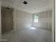 Unfinished bedroom with large windows, drywall, and natural lighting exposure at 16178 W Bajada Rd, Surprise, AZ 85387