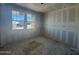 Bright, unfinished bedroom with large windows and natural light exposure at 16178 W Bajada Rd, Surprise, AZ 85387