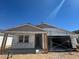 Exterior view of a single-Gathering home under construction with a two-car garage and covered entry at 16178 W Bajada Rd, Surprise, AZ 85387
