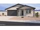 Charming single story home featuring a two car garage and desert landscaping at 16178 W Bajada Rd, Surprise, AZ 85387
