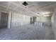 Large living space with rough drywall, multiple windows, and recessed ceiling lighting at 16178 W Bajada Rd, Surprise, AZ 85387