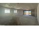 Open living space showcasing sliding glass doors, large windows and lots of space at 16178 W Bajada Rd, Surprise, AZ 85387