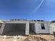 New home under construction showing the framing, garage, door and window placement on the building at 16182 W Bajada Rd, Surprise, AZ 85387
