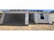 New construction features an attached garage and durable exterior material at 16182 W Bajada Rd, Surprise, AZ 85387