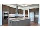 Spacious kitchen featuring stainless steel appliances, granite countertops, and stylish cabinetry at 16777 W Sheila Ln, Goodyear, AZ 85395
