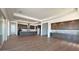 Open-concept living area with hardwood floors and a modern kitchen with stainless steel appliances at 16777 W Sheila Ln, Goodyear, AZ 85395