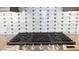 Modern gas cooktop with sleek backsplash and stainless steel knobs for precise temperature control at 16777 W Sheila Ln, Goodyear, AZ 85395