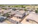 Aerial view of a home featuring a spacious backyard with a covered patio and block fence at 16917 W Sonora St, Goodyear, AZ 85338