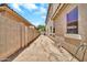 Long backyard showcasing block wall, and neutral exterior of home at 16917 W Sonora St, Goodyear, AZ 85338