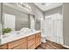 Bright bathroom with double sinks, nice cabinets, and a shower/tub combination at 16917 W Sonora St, Goodyear, AZ 85338