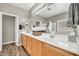 Bathroom with double sinks, a bathtub and nice-looking hardwood-style flooring at 16917 W Sonora St, Goodyear, AZ 85338