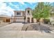 Charming two-story home featuring a spacious driveway and a well-manicured front yard with a mature tree at 16917 W Sonora St, Goodyear, AZ 85338