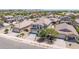 Beautiful two-story home with a tile roof, basketball hoop, and a well-manicured front yard at 16917 W Sonora St, Goodyear, AZ 85338