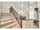 Inviting foyer with a staircase, wood-look floors, high ceilings, neutral paint, and ample natural light at 16917 W Sonora St, Goodyear, AZ 85338