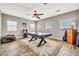 This entertainment space features an air hockey table, an arcade game, and natural light at 16917 W Sonora St, Goodyear, AZ 85338