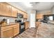 A cozy kitchen showcasing wooden cabinetry, stainless steel appliances, and sleek countertops at 16917 W Sonora St, Goodyear, AZ 85338